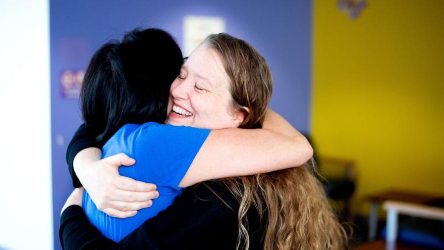 Two people hugging